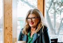 Converse with a bestselling author Lisa Ireland holds a cup of coffee