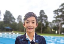Xavier breaks swimming record again and again
